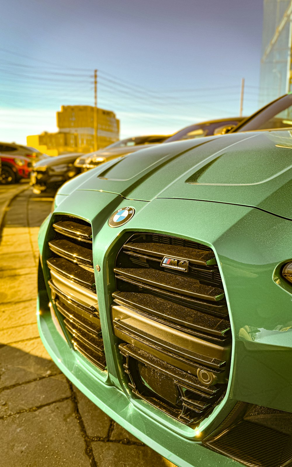 a green sports car parked in a parking lot