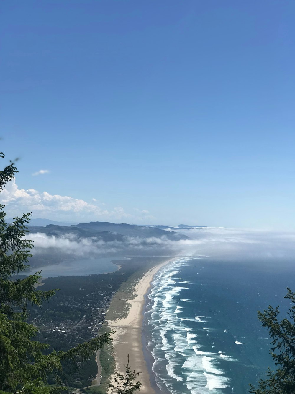 a view of a beach from a hill