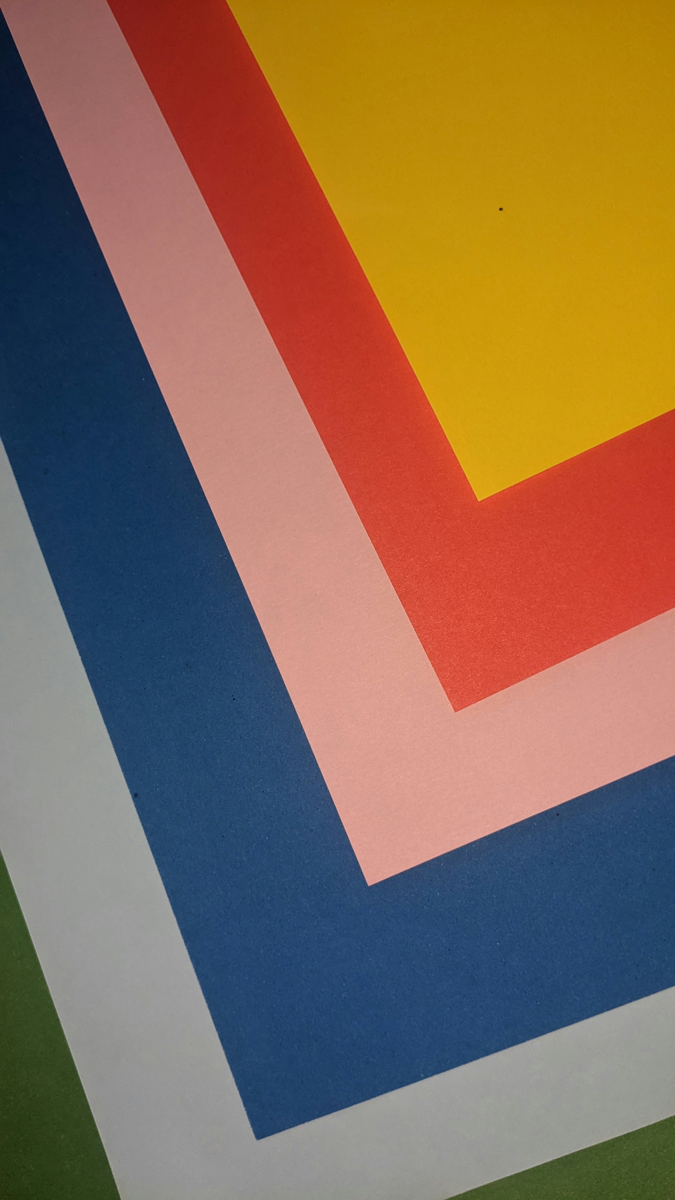 a close up of a multicolored floor with a phone