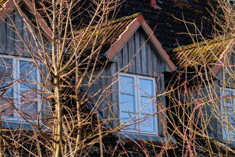 a house with a clock on the front of it