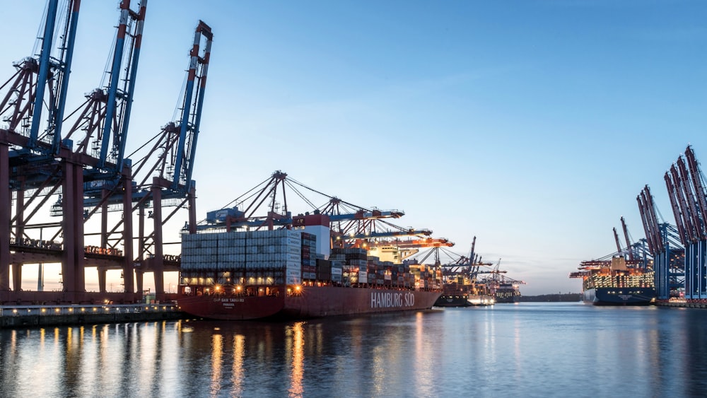 a group of large ships docked in a harbor