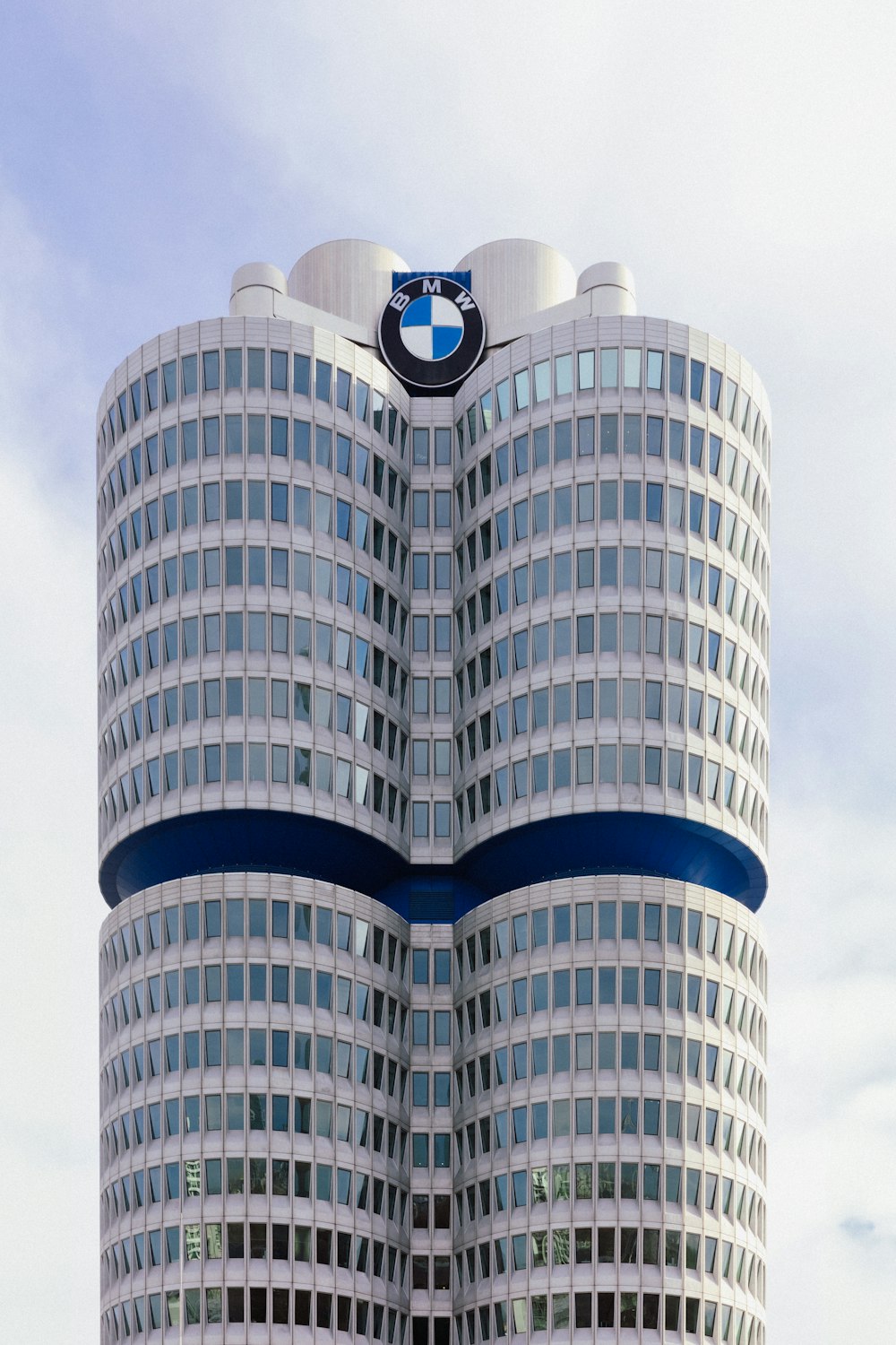 a very tall building with a bmw logo on it's side