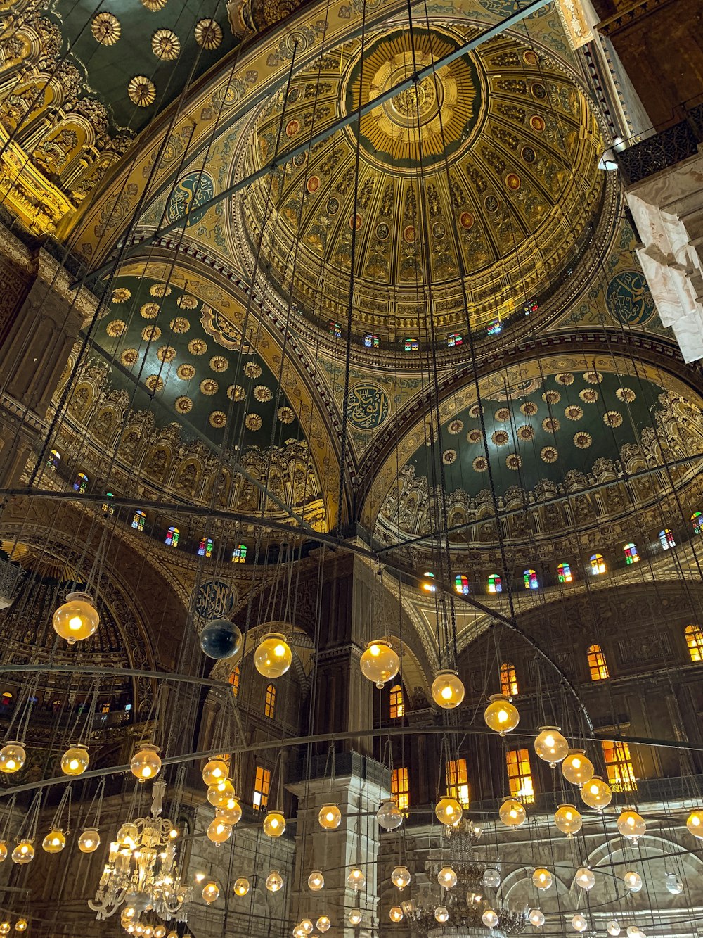 the ceiling of a large building with chandeliers hanging from it