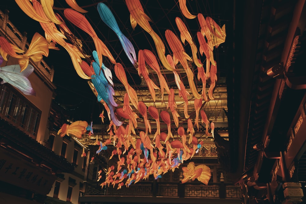 a bunch of colorful objects hanging from the ceiling