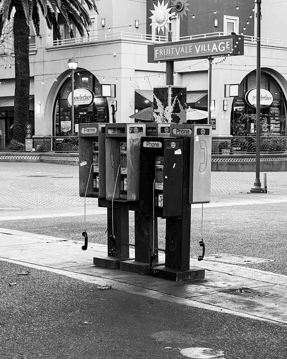 a couple of machines sitting on the side of a road