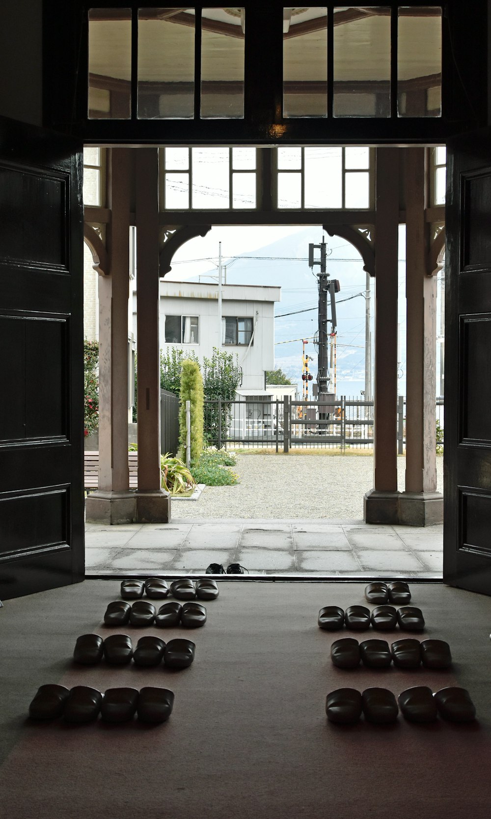 an open door leading into a building with a lot of stones on the floor