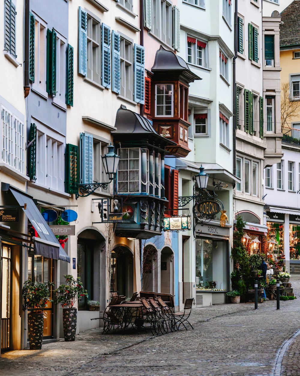 a cobblestone street lined with tall buildings