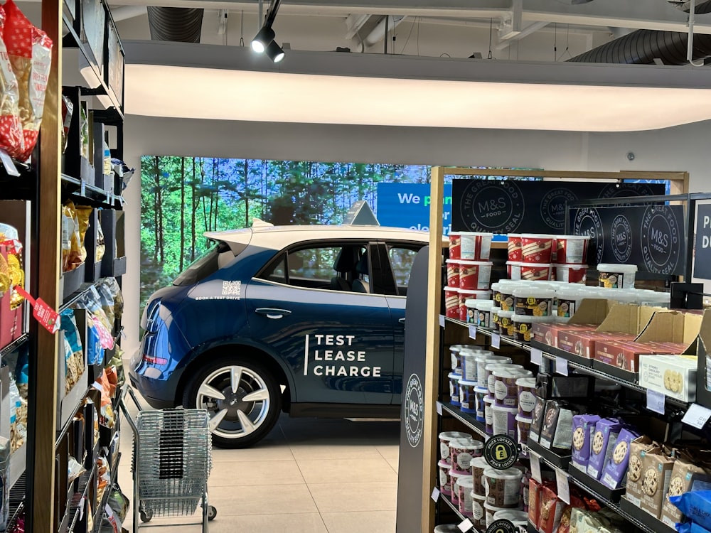 a car parked inside of a store filled with items