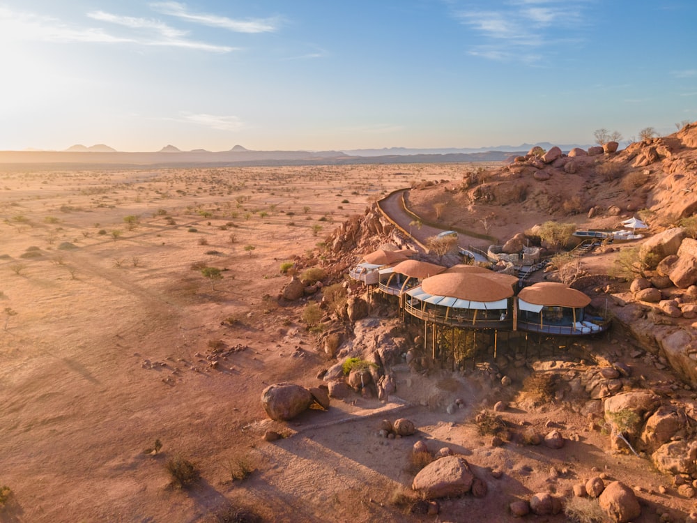 an aerial view of a desert resort with a mountain in the background