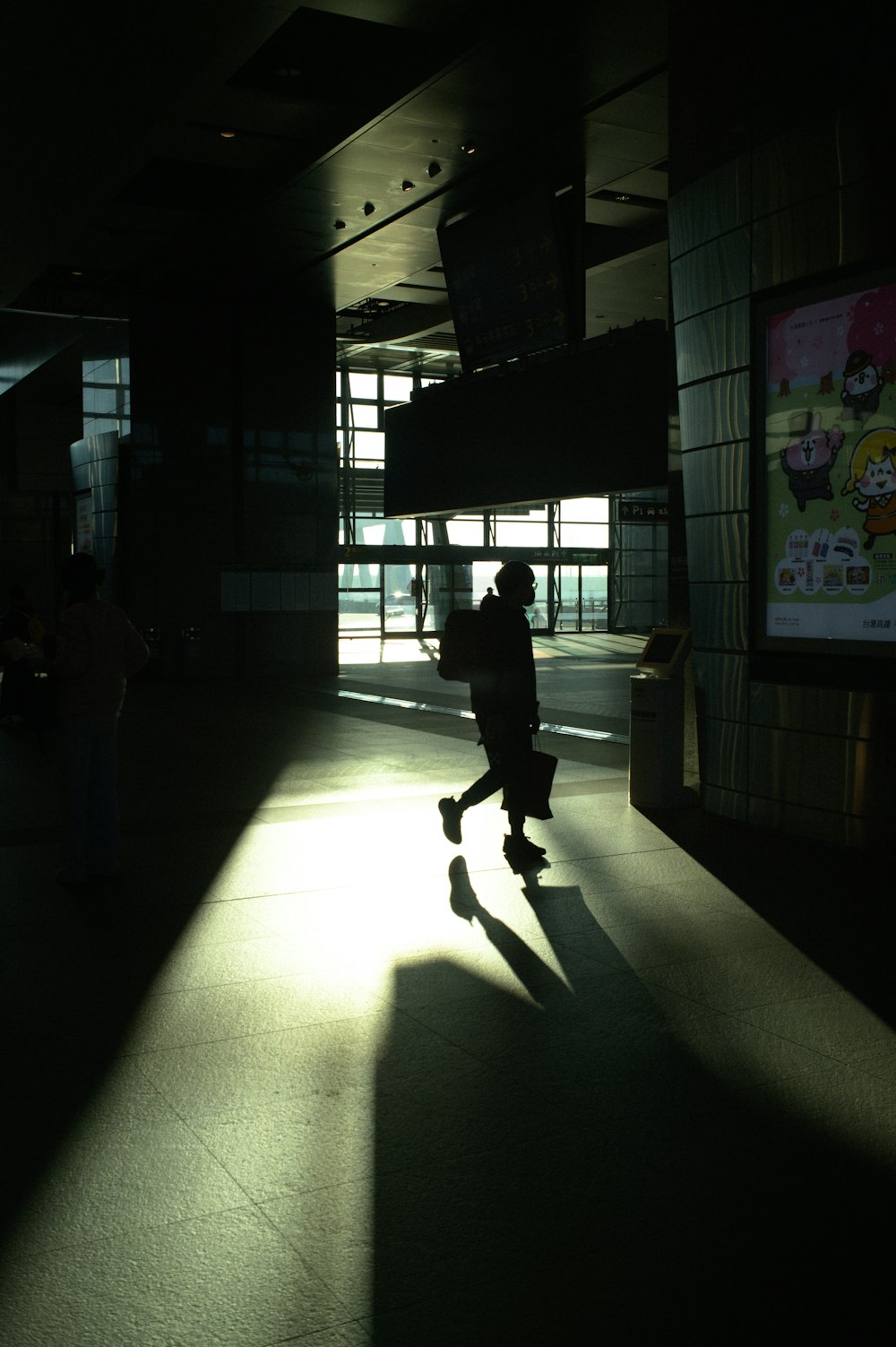 a person riding a skateboard in a dark room