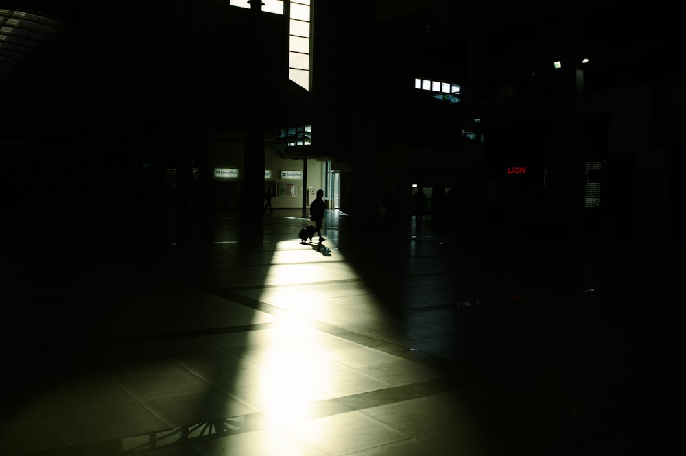 a person walking down a dark street at night