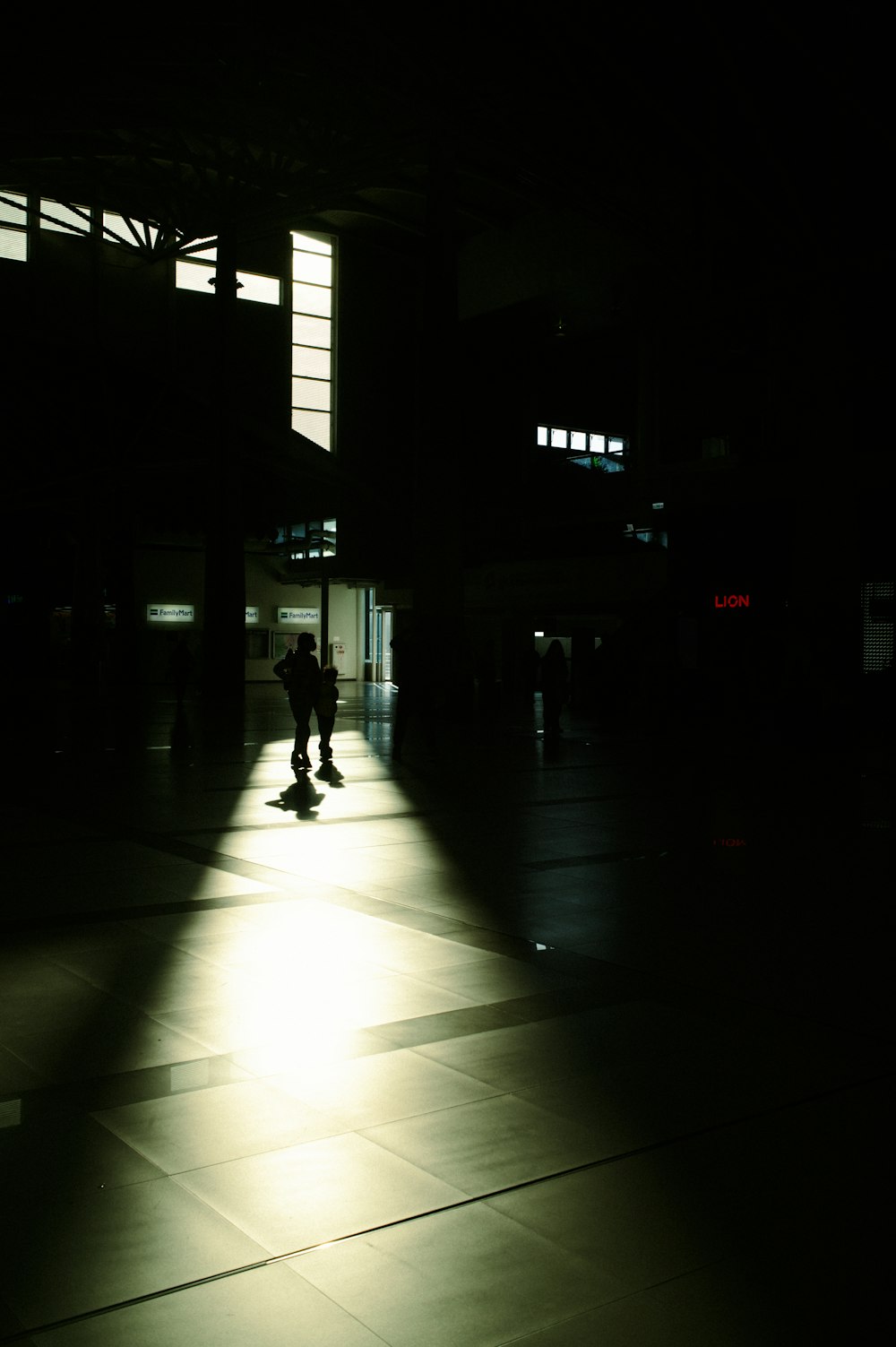 a person standing in the middle of a dark room