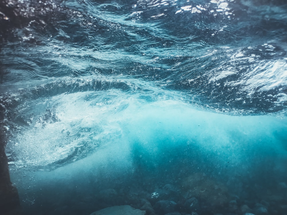 a view of the water from under the surface of the ocean