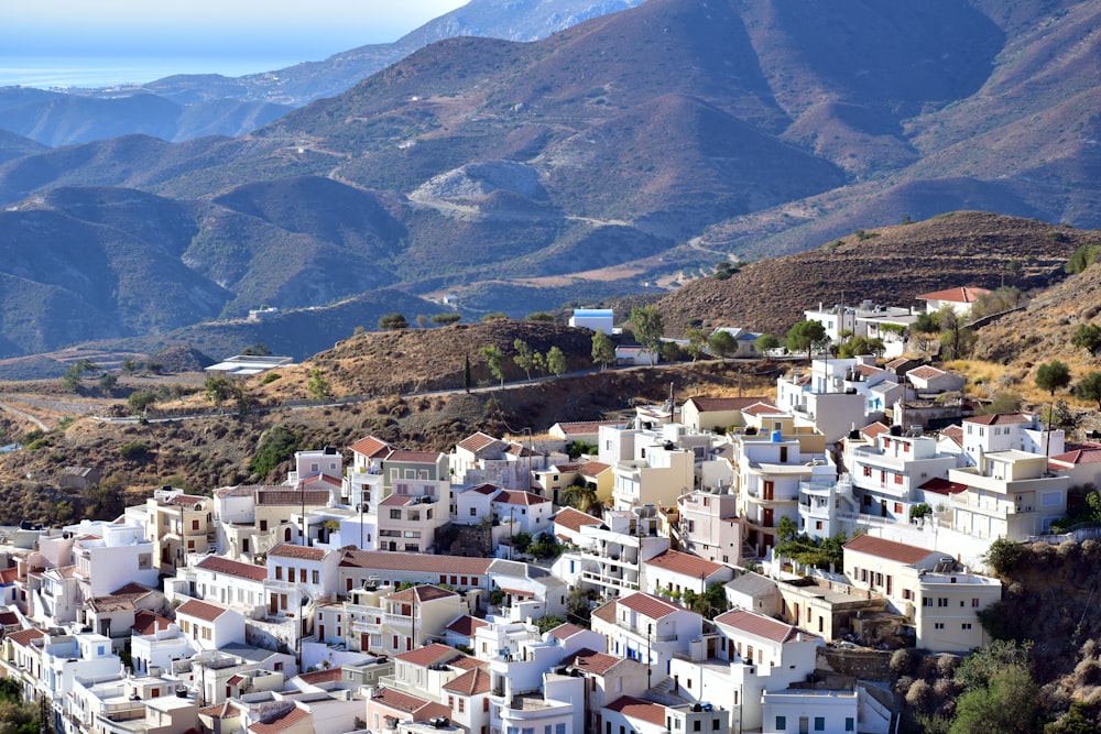 a view of a town with mountains in the background