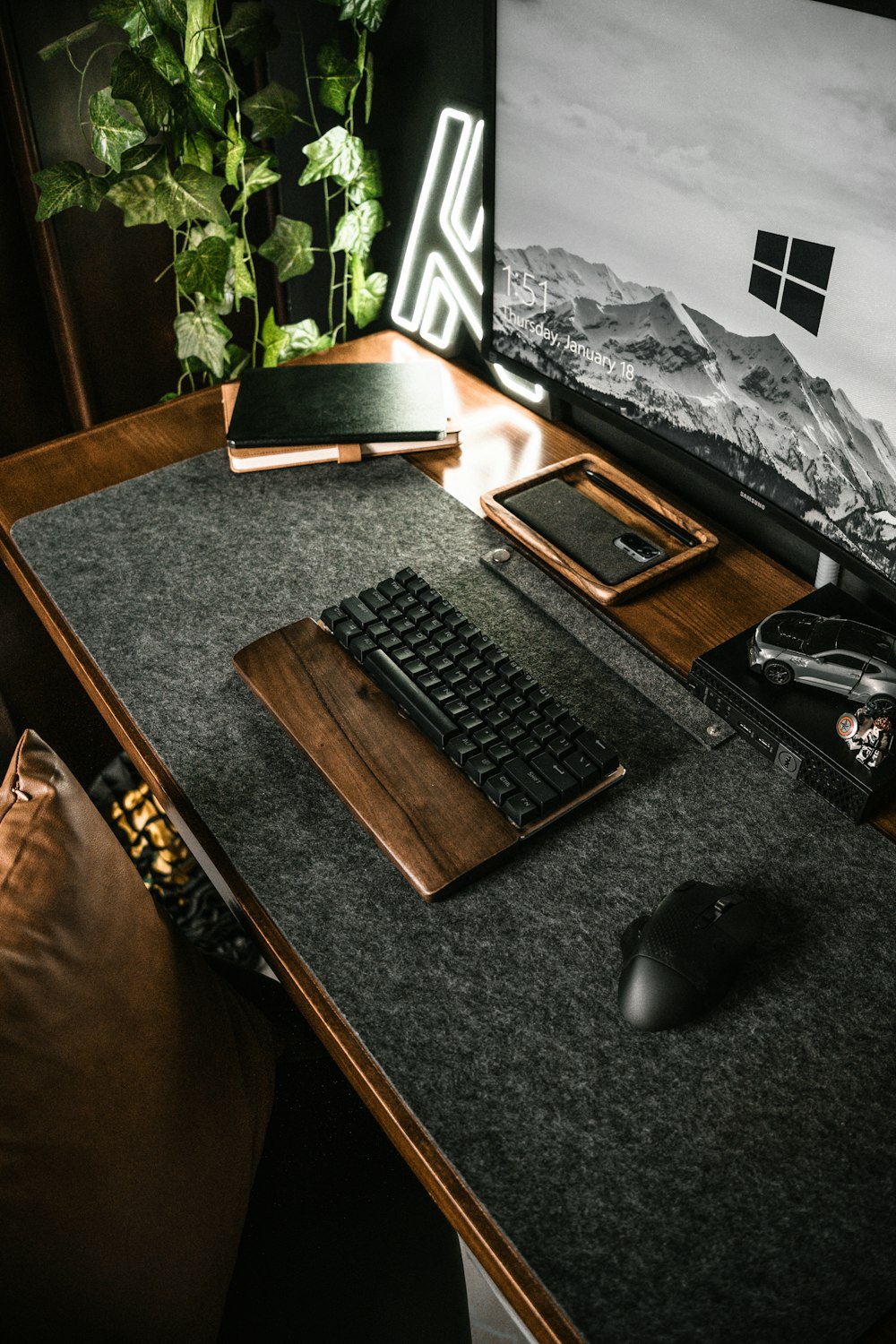 a computer desk with a keyboard and mouse