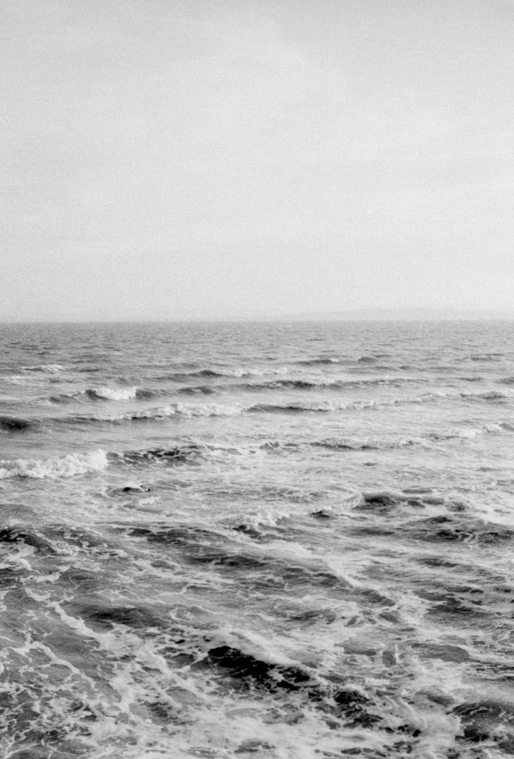 a black and white photo of the ocean
