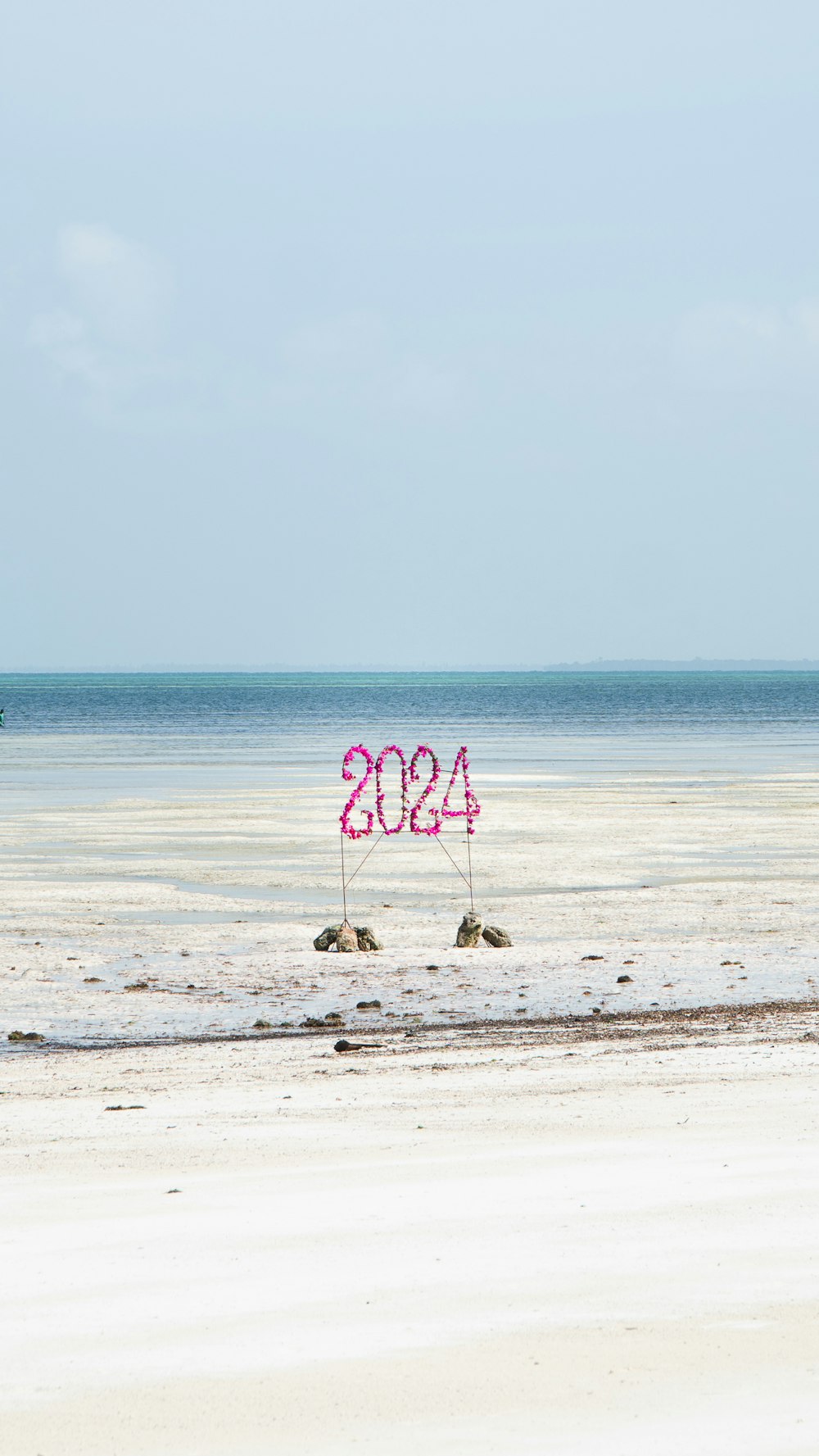 a sign that reads 420 on a beach