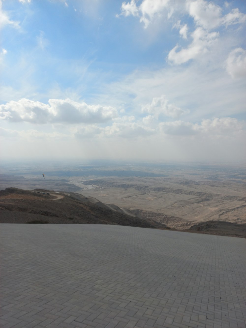 a view of the desert from the top of a hill