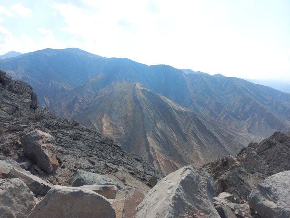 a view of a mountain range from the top of a mountain