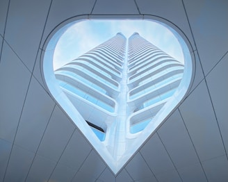 a very tall building with a sky background