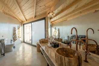 a bathroom with two sinks and a tub