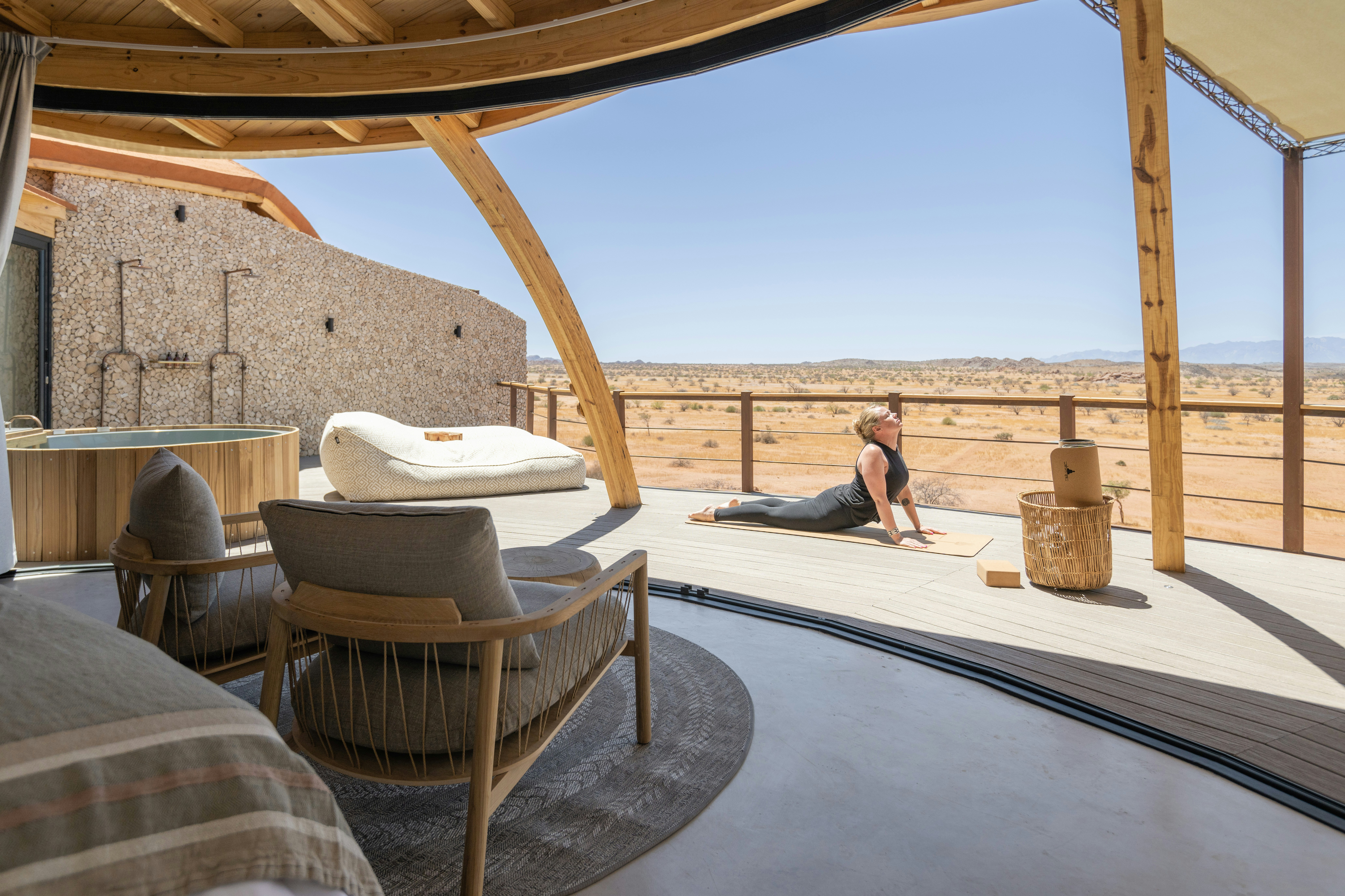 a woman sitting on a bed in a room