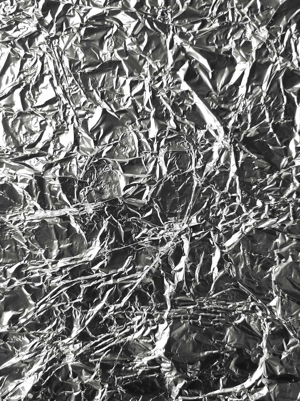 a black and white photo of tin foil
