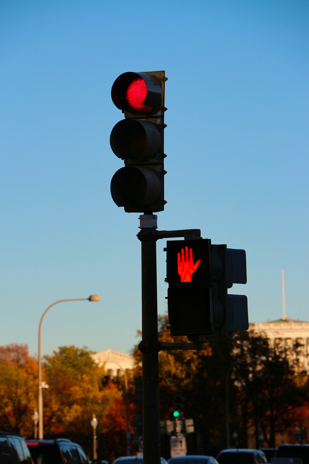 a traffic light with a red hand on it