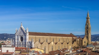a view of a city with a church in the background