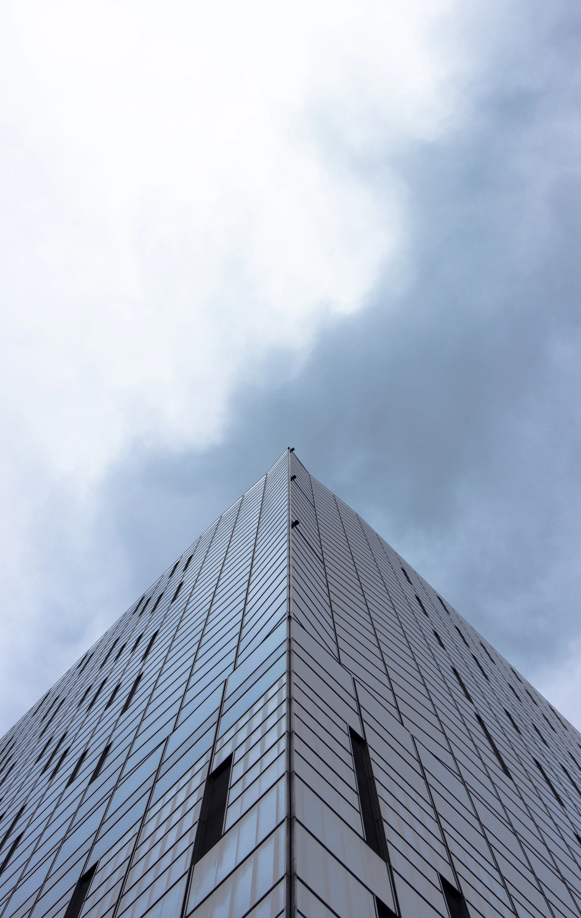 a very tall building with a sky in the background