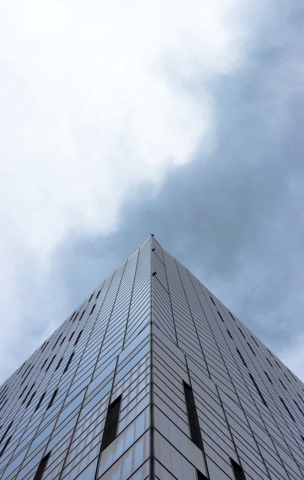 a very tall building with a sky in the background