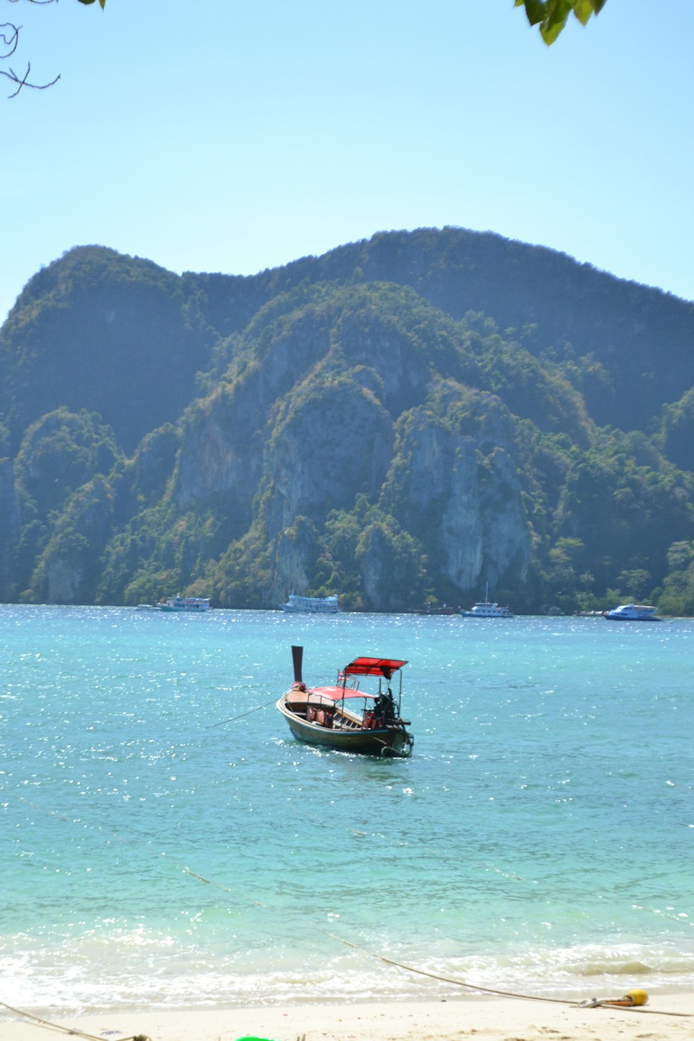 a small boat floating on top of a body of water