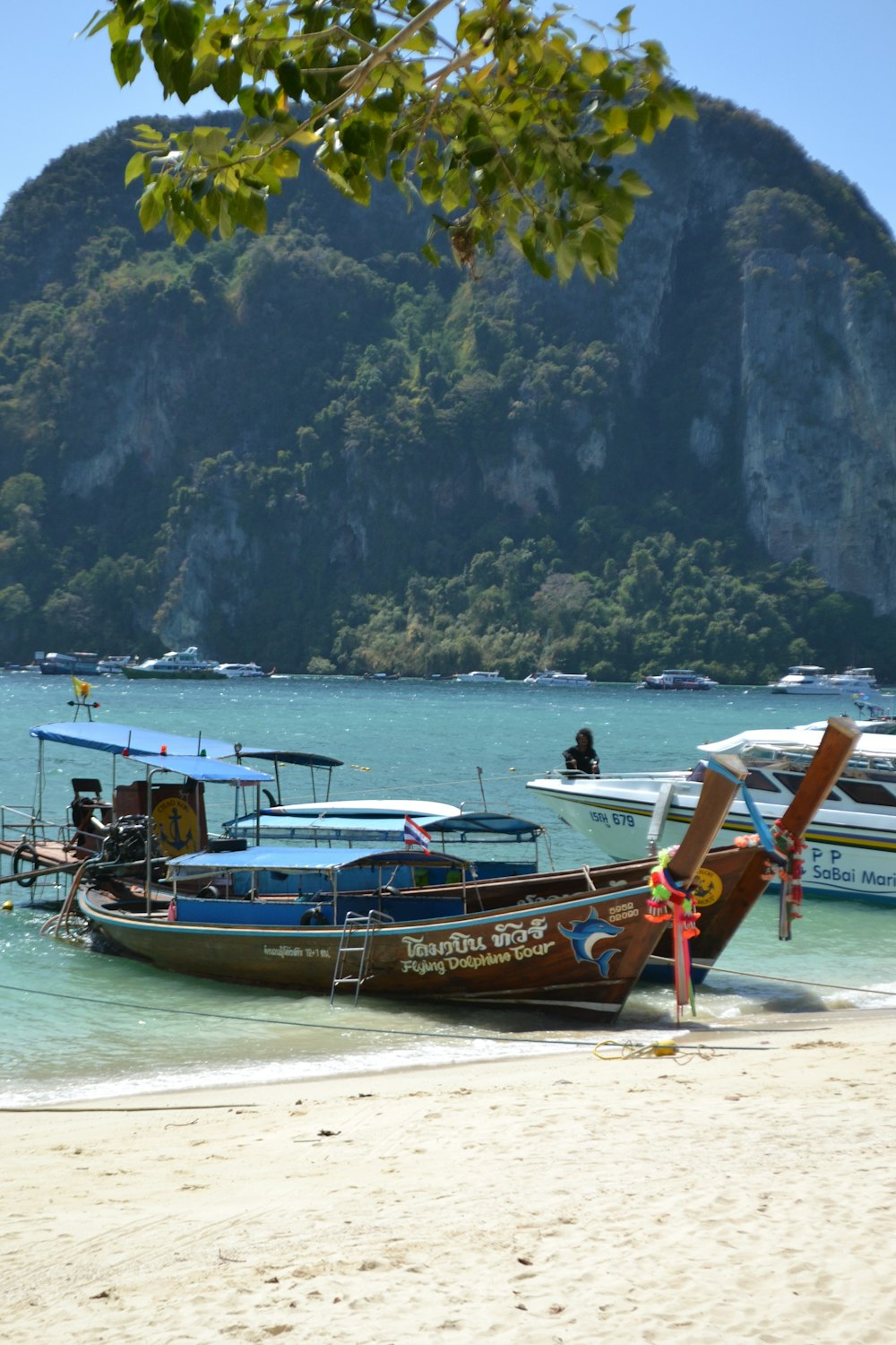 a couple of boats sitting on top of a beach