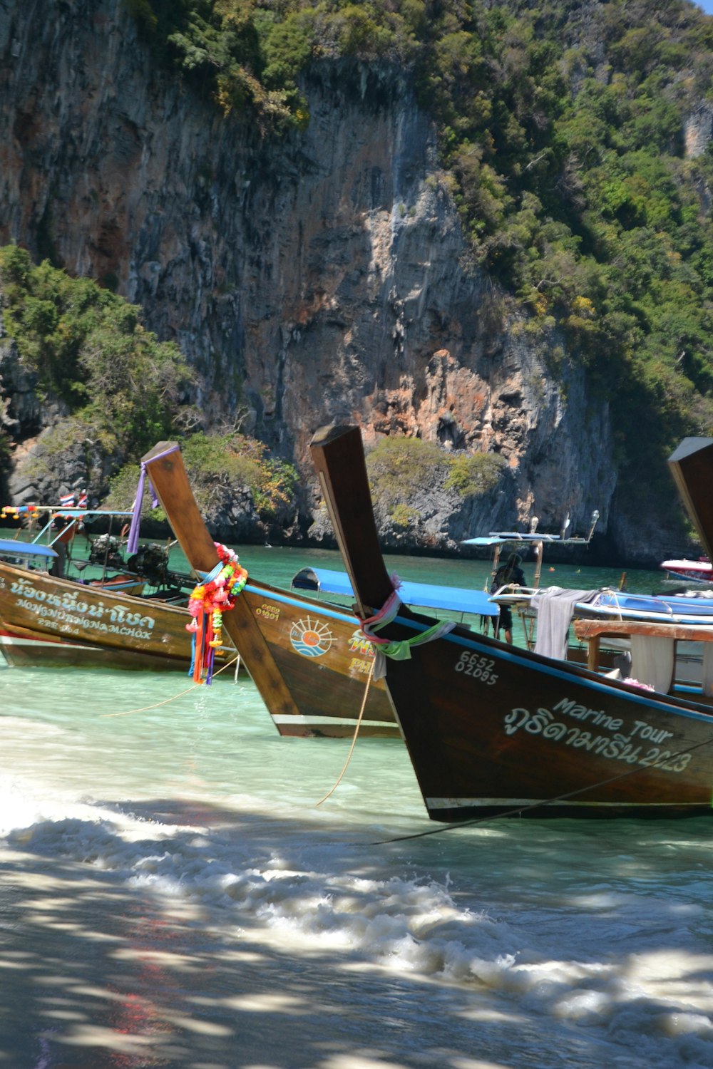 a group of boats that are sitting in the water