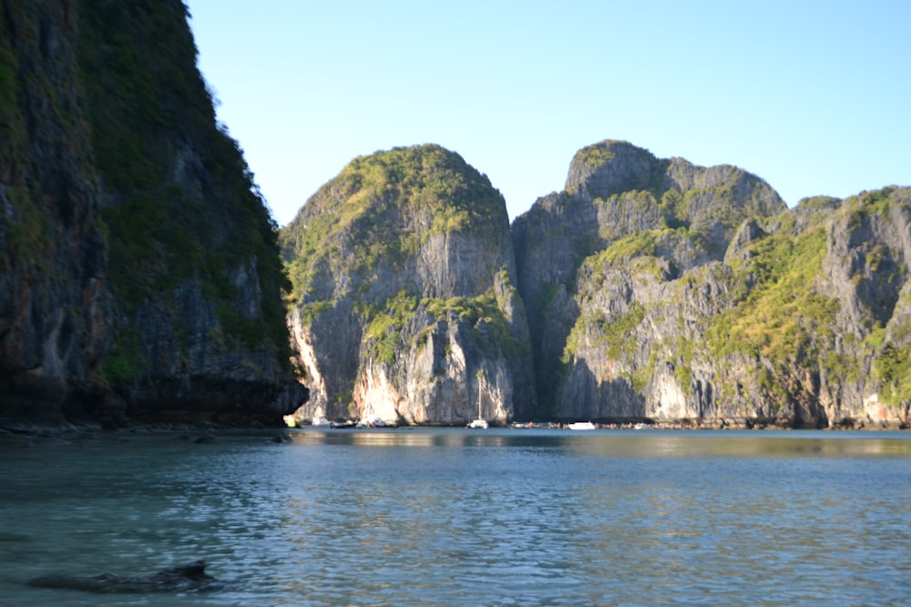 a body of water with mountains in the background