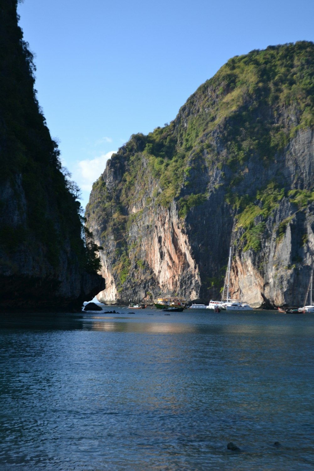 a body of water with a mountain in the background