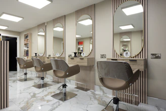 a hair salon with chairs and mirrors