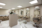 a room with a bunch of chairs and mirrors