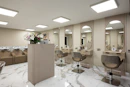 a room with a bunch of chairs and mirrors