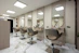 a hair salon with chairs and mirrors