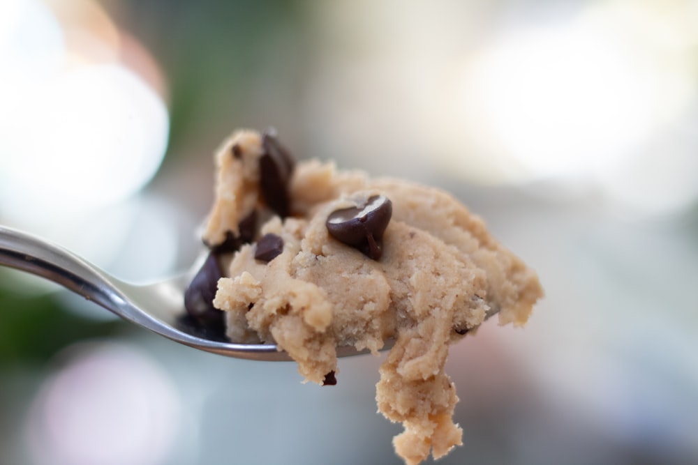 a spoon full of chocolate chip ice cream