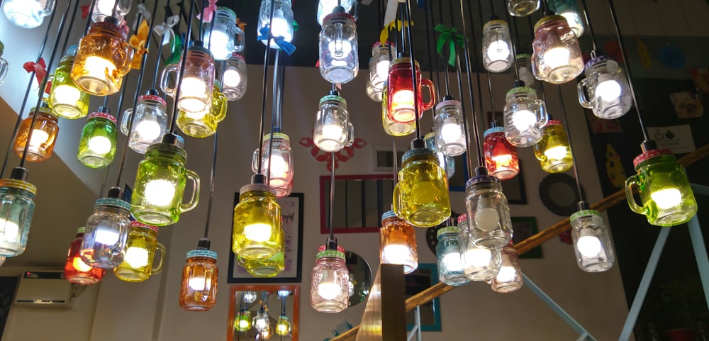 a chandelier made of glass jars and lights