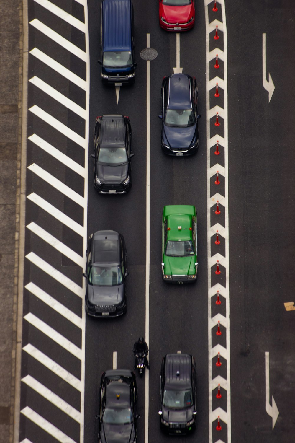 a group of cars that are sitting in the street