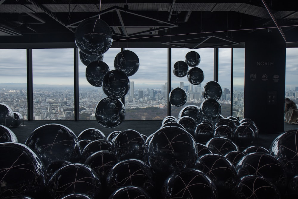 a large room filled with lots of shiny balls