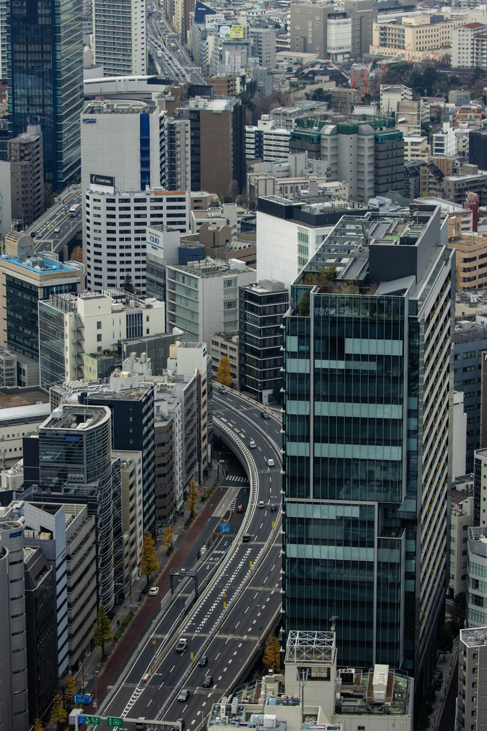 an aerial view of a city with tall buildings