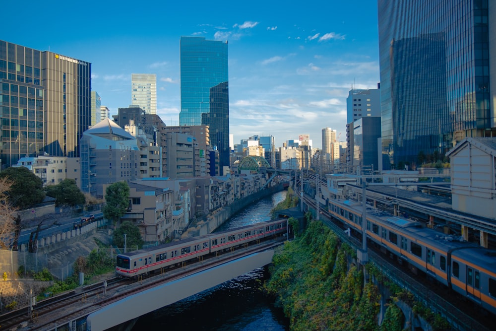 a train traveling over a bridge over a river