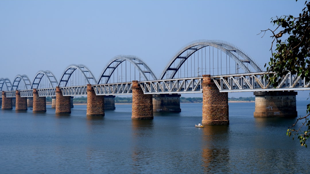 a bridge over a large body of water, Havelock Railway Bridge (Front 1930~1996) and Indian Railway Godavari Railway Bridge (Behind 1997~2100) Both the Bridges are the Asia