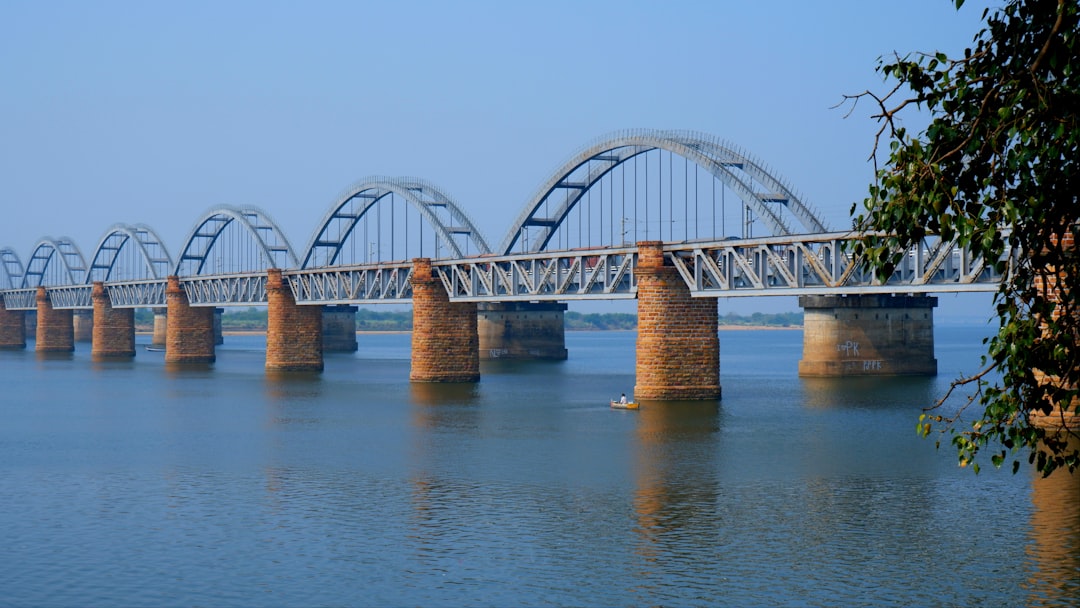 a long bridge over a large body of water, Havelock Railway Bridge (Front 1930~1996) and Indian Railway Godavari Railway Bridge (Behind 1997~2100) Both the Bridges are the Asia