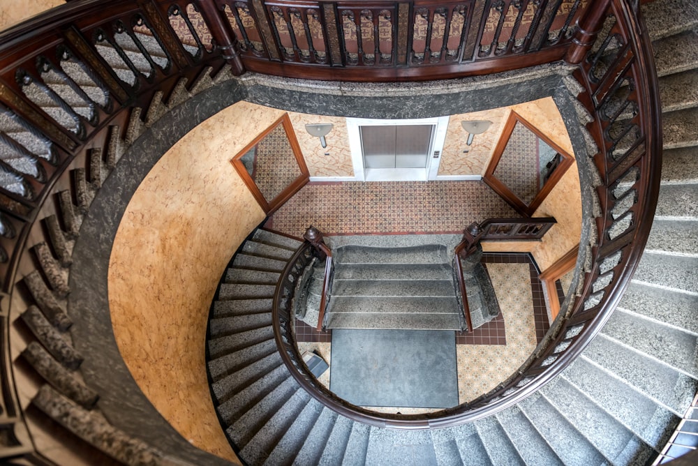 an aerial view of a spiral staircase in a building