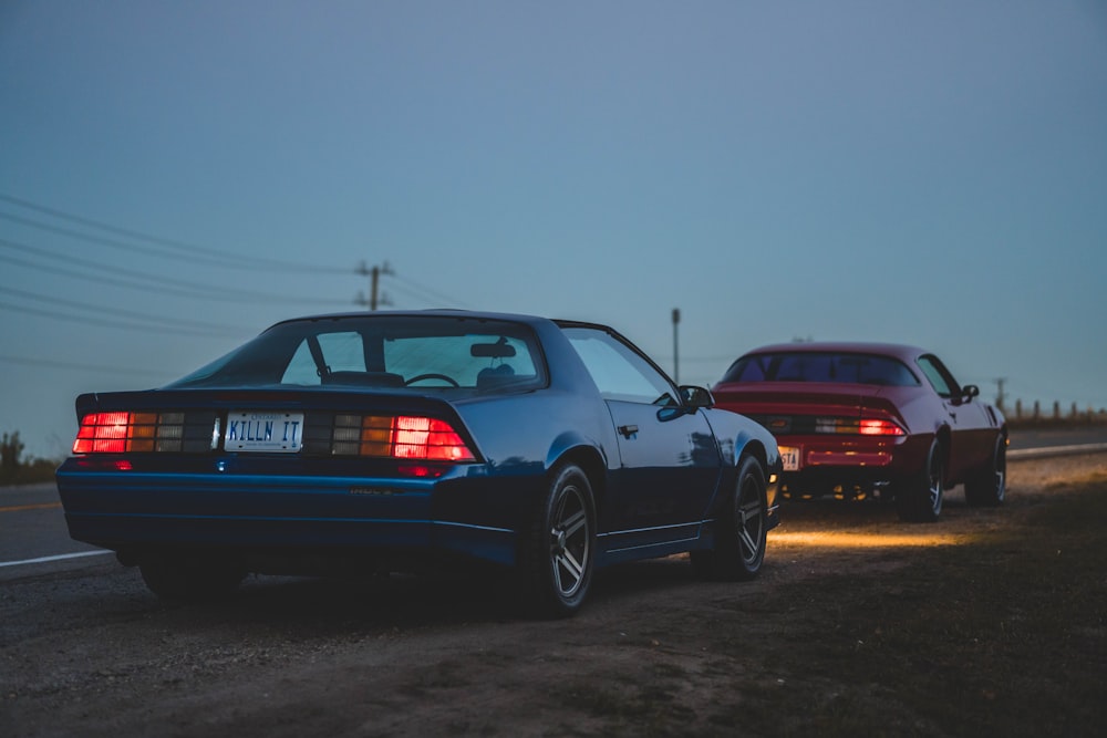 a couple of cars parked on the side of the road